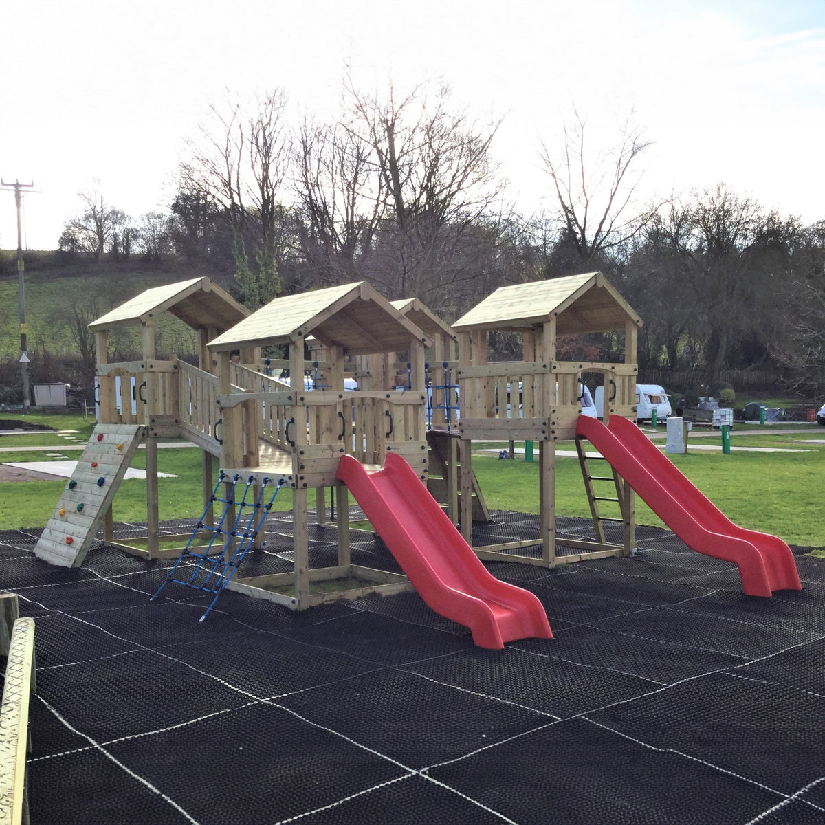 Ludlow Commercial Climbing frame with towers, slides, climbing wall, climber, fireman’s pole and bridges